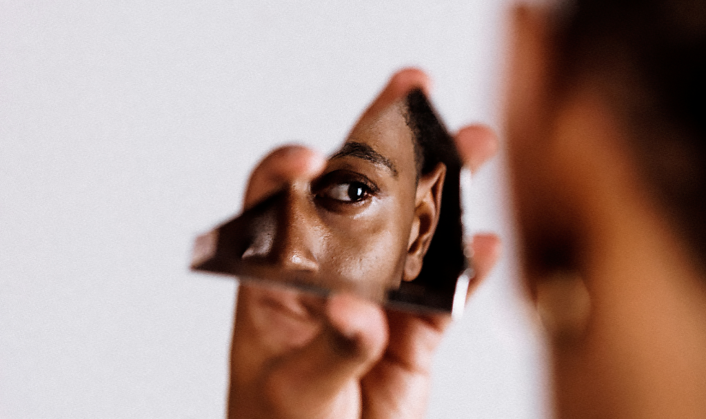 Recognizing the Signs of a Mental Health Spiral Recognizing the Signs of a Mental Health Spiral. Image of a person looking into a shard of glass.