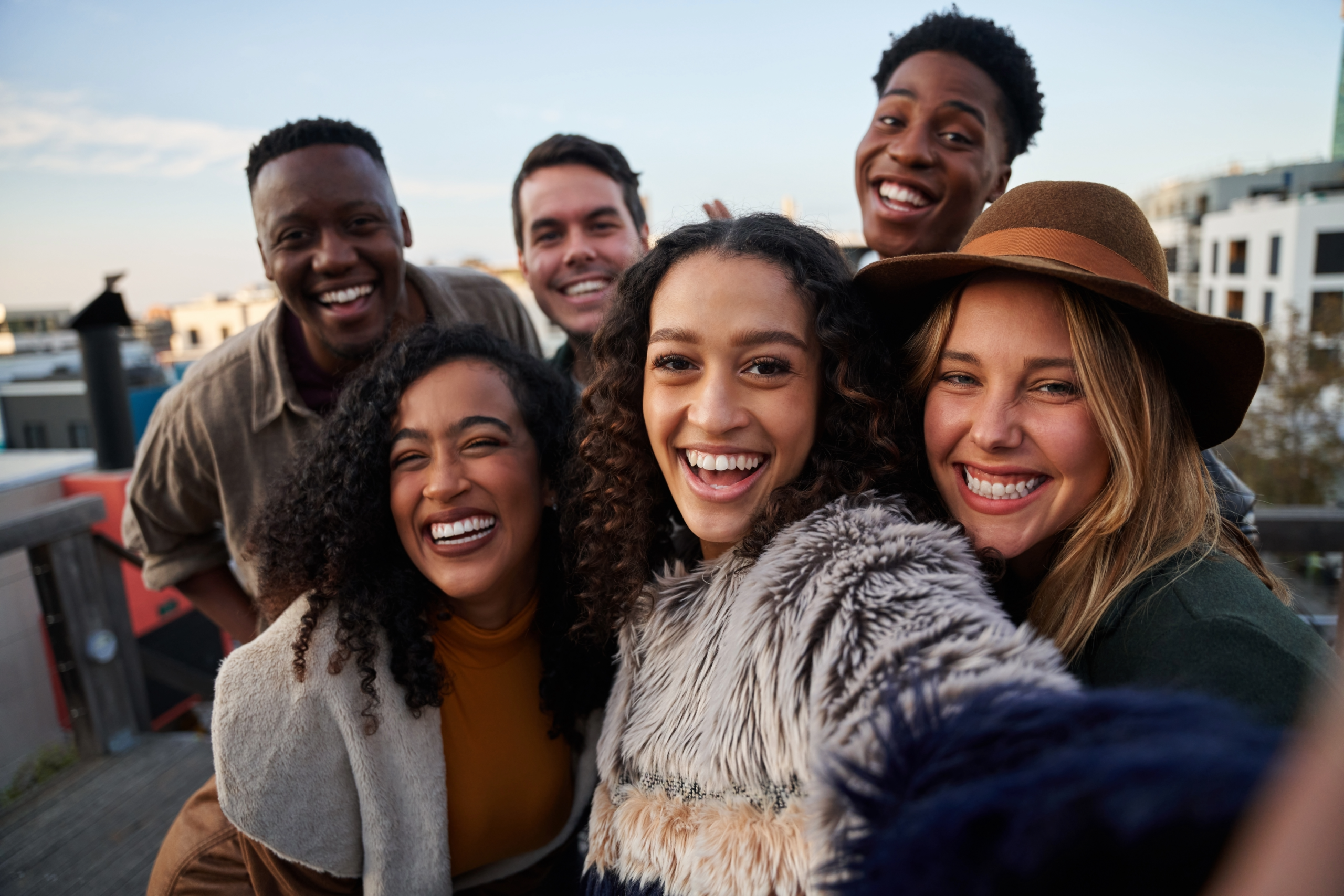 Emerging Adulthood: Finding Yourself in the In-Between Years. Image of a group of young adult friends.